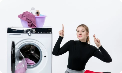front view young female with washing machine dirty clothes white wall